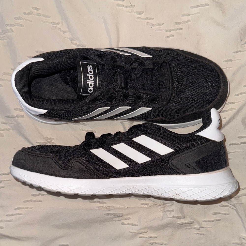 Adidas Women’s Black Sneakers with White Stripes